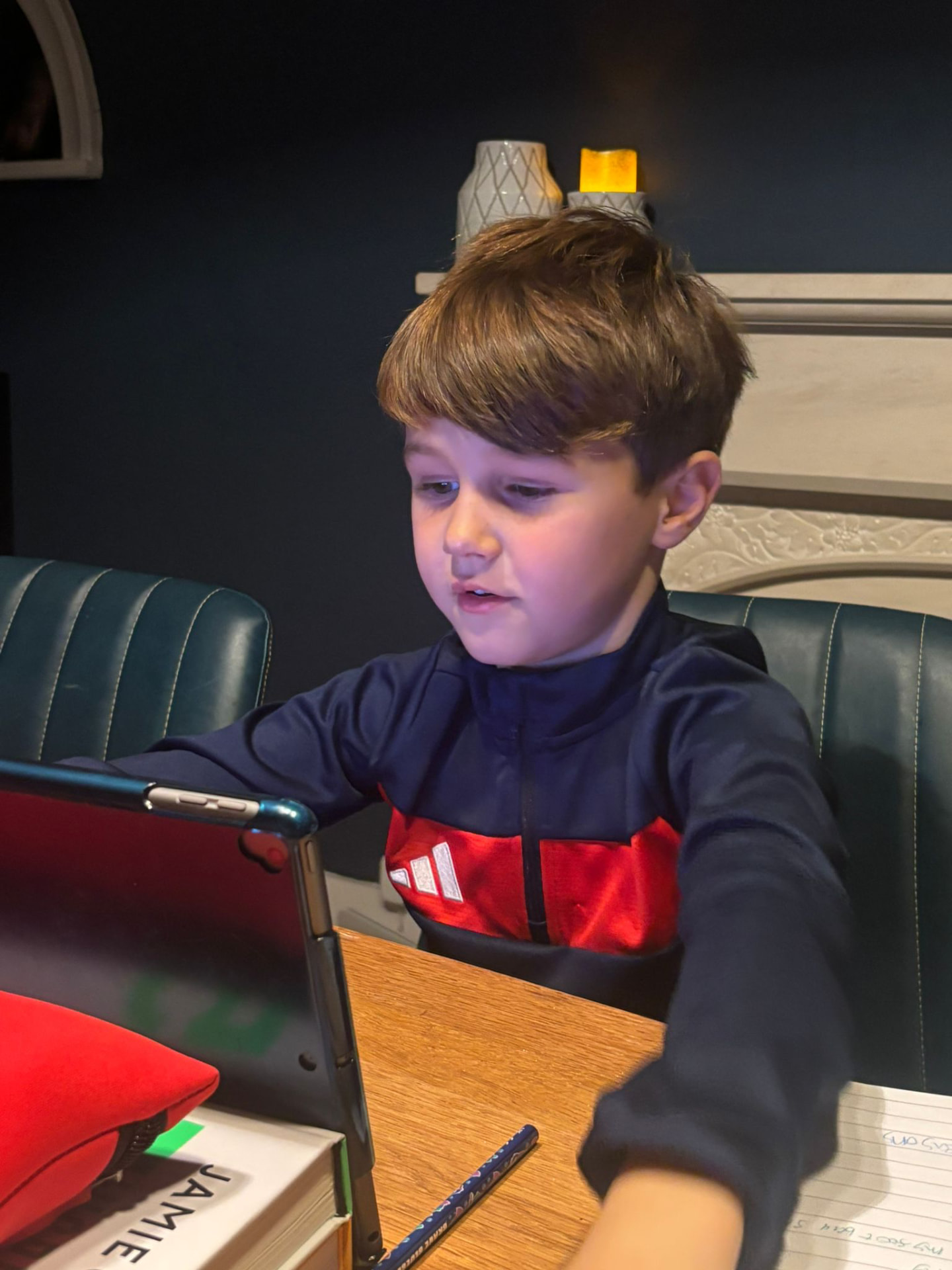 A young footballer taking part in a live online Confidence Academy session from home